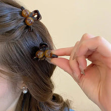 Tortoiseshell acrylic hair claw clip with brown beaded black accents