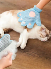 Touch Pet Hair Remover Glove with light blue paw shape and pink silicone nodules