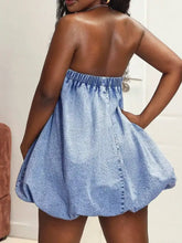 Light blue denim dress with elastic waistband and puffed sleeves featuring a tube bubble hem design