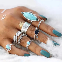 Turquoise alloy 8-piece ring set with silver-toned turquoise and black accents