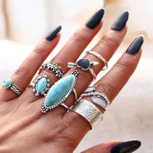Turquoise alloy 8-piece ring set with silver rings and blue stones