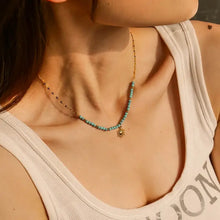 Turquoise beaded sun charm necklace with 18k gold-plated sun charm