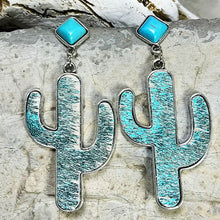 Pair of silver-rimmed turquoise cactus earrings with square studs