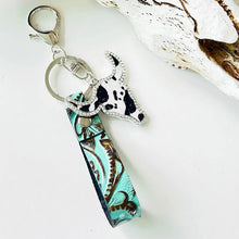 Turquoise rhinestone bull keychain with brown floral leather strap and cow skull charm