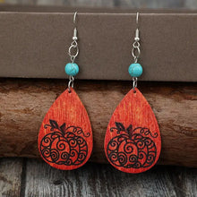 Turquoise wooden pumpkin teardrop earrings with carved design