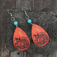 Turquoise wooden pumpkin teardrop earrings with carved design