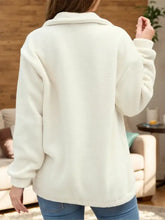 Cream-colored fuzzy fleece turtleneck half zip long sleeve sweatshirt