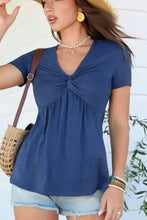 Blue short sleeve blouse with twist knot front detail and v neck in soft breathable fabric for casual wear