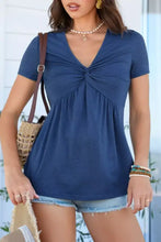 Navy blue short sleeve blouse with v neck and twist knot front detail ideal for casual and office wear