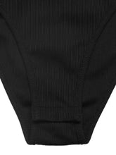 Black ribbed fabric bikini bottom with smooth seamless design paired with a two tone long sleeve bodysuit