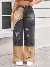 High-waisted two-tone ripped wide leg jeans in dark gray and tan denim with distressed patches and raw hems