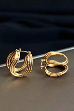 Two golden twisted layered U-shaped hoop earrings
