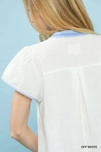 Off-white umgee abstract applique split neck short-sleeved blouse with blue and white striped collar and sleeve trim