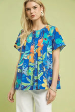 Umgee abstract floral pleated blouse in blue with vibrant orange green and teal botanical print short sleeves