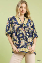 Navy blue umgee apricot floral boho blouse with yellow peach accents v-neckline and short flutter sleeves