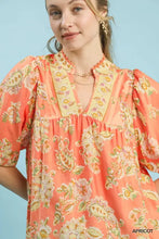 Umgee apricot floral blouse with paisley print in cream pink and green tones featuring puffed sleeves and ruffled neckline