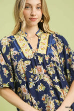 Navy blue floral boho blouse with apricot floral print and yellow and navy striped collar by Umgee