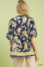 Navy blue apricot floral boho blouse with short flutter sleeves and a decorative hemband by umgee