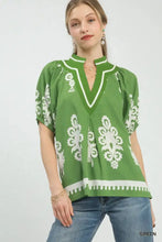 Green embroidered blouse with white floral boho print featuring short sleeve and v-neck split neck design