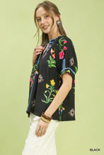 Black umgee botanical print contrast trim button blouse with colorful blossoms green leaves and blue contrast trim