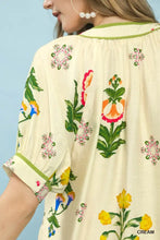 Cream-colored umgee botanical print button blouse with vibrant pink orange yellow and green floral embroidery