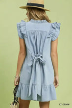 Light blue chambray ruffled denim dress with ruffled sleeves hem back tie detail and side pockets by Umgee