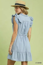 Light blue chambray ruffled denim dress with tiered skirt and side pockets by Umgee