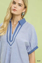 Blue and white striped umgee contrast trim popover top with solid blue collar v-neckline and puffed short sleeves