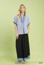 Umgee contrast trim popover stripe top in blue and white vertical stripes with short sleeves and a v-neck collar
