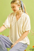 Cream-colored umgee cotton gauze ruffle top with lightweight cotton gauze fabric lace trim and ruffled sleeves