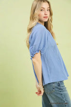 Light blue umgee cotton gauze ruffle top with puffed sleeves and delicate lace detailing along the side