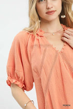 Peach-colored lightweight cotton gauze ruffle blouse with delicate lace trim and ruffled neckline by umgee cotton gauze ruffle top