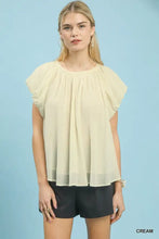 Cream-colored lightweight chiffon umgee crinkle flutter sleeve peasant top with puffed short sleeves and gathered neckline