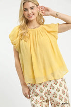 Umgee crinkle flutter sleeve peasant top in soft yellow lightweight fabric with ruffled short flutter sleeves and gathered neckline