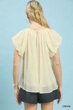 Cream-colored lightweight chiffon umgee crinkle flutter sleeve peasant top with puffy short sleeves and subtle back slit