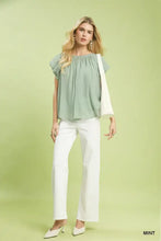 Mint-colored Umgee crinkle flutter sleeve peasant top with lightweight fabric, ruffled sleeves, and gathered neckline