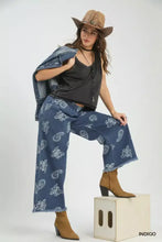 Umgee denim paisley wide-leg pants in blue denim with white paisley print and frayed hems