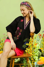 Black umgee embroidered floral v-neck blouse with pink and purple floral embroidery on lightweight fabric