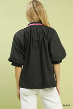 Black umgee embroidered floral blouse with puffy sleeves and pink trim at the collar for stylish wear