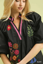 Black umgee embroidered floral blouse features vibrant pink and green floral embroidery with a v-neck design