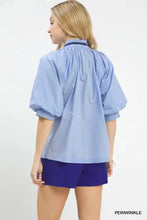 Light blue umgee embroidered floral blouse with puffed sleeves and navy collar featuring v-neck design