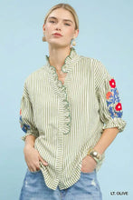 Umgee embroidered ruffle trim stripe blouse with light olive and white stripes and vibrant floral embroidery on sleeves