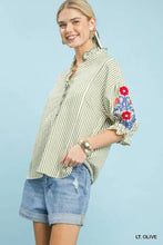 Umgee embroidered ruffle trim stripe blouse in light olive and white with red and blue floral embroidery and three-quarter sleeves