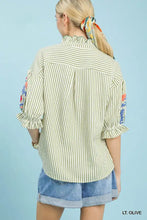 Umgee embroidered ruffle trim stripe blouse in light olive and white with floral patches and frilled collar