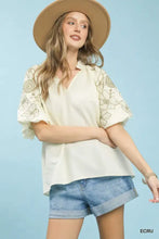 Cream-colored umgee embroidered v-neck blouse features delicate floral embroidery on the sleeves for a boho look