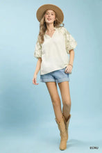 Beige umgee embroidered boho blouse features floral embroidery on the sleeves and a v-neck design