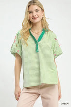 Light green and white umgee embroidered stripe blouse with floral sleeve embroidery and emerald v-neckline button details