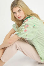 Light green short-sleeved blouse with colorful floral embroidery featuring umgee embroidered stripe design
