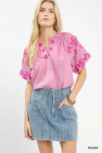 Pink umgee embroidered textured flutter sleeve blouse with puff sleeves and a ruffled neckline for elegant wear