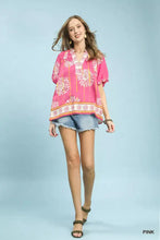 Pink umgee floral border smocked v-neck boho blouse with short sleeves and a lightweight floral print fabric
